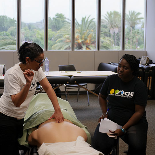Massage therapy student practicing therapeutic techniques at SOCHI Van Nuys campus